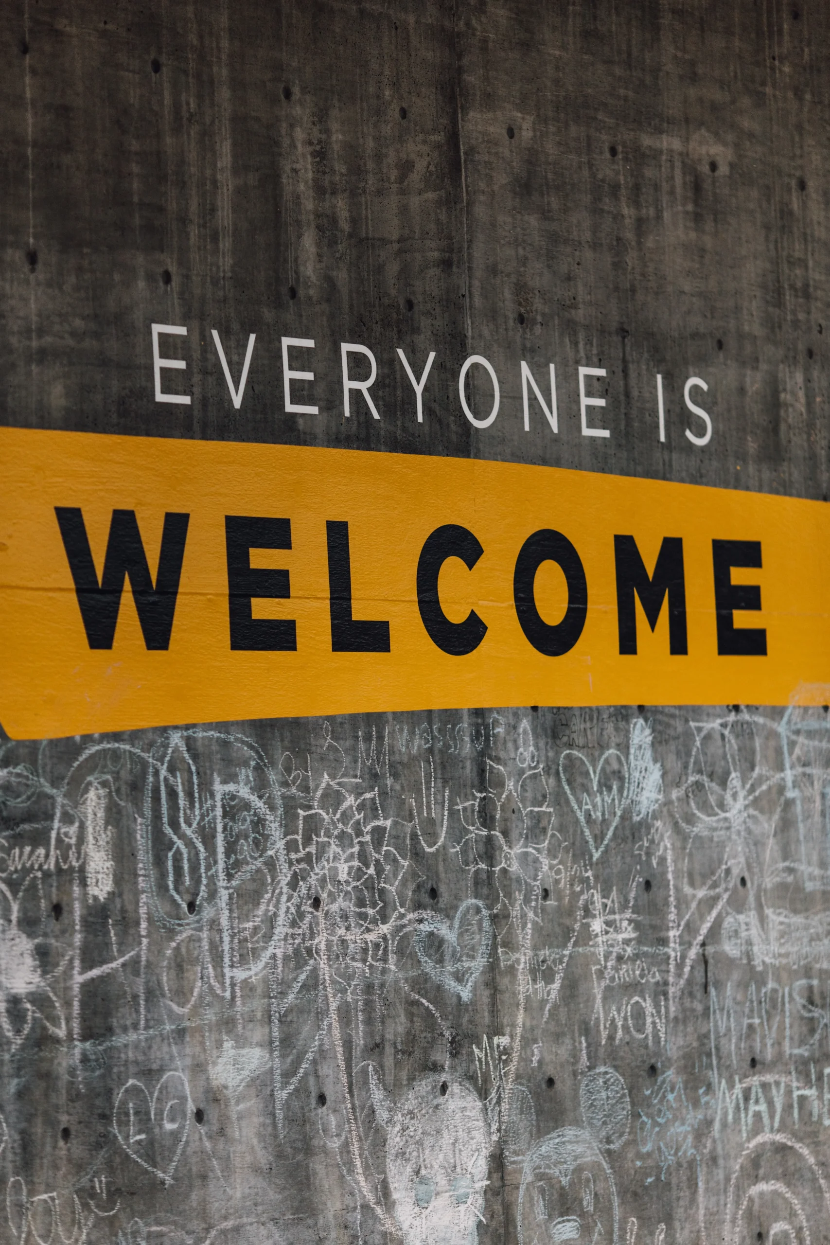 Everyone is welcome sign working with an immigration lawyers